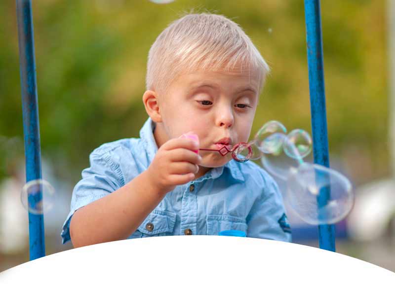 Disabled Boy Blowing Bubbles